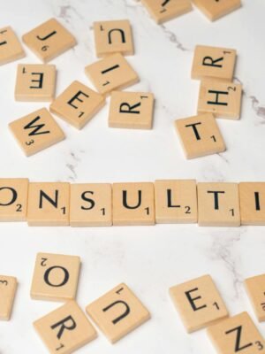 The word consulting spelled out in scrabble tiles